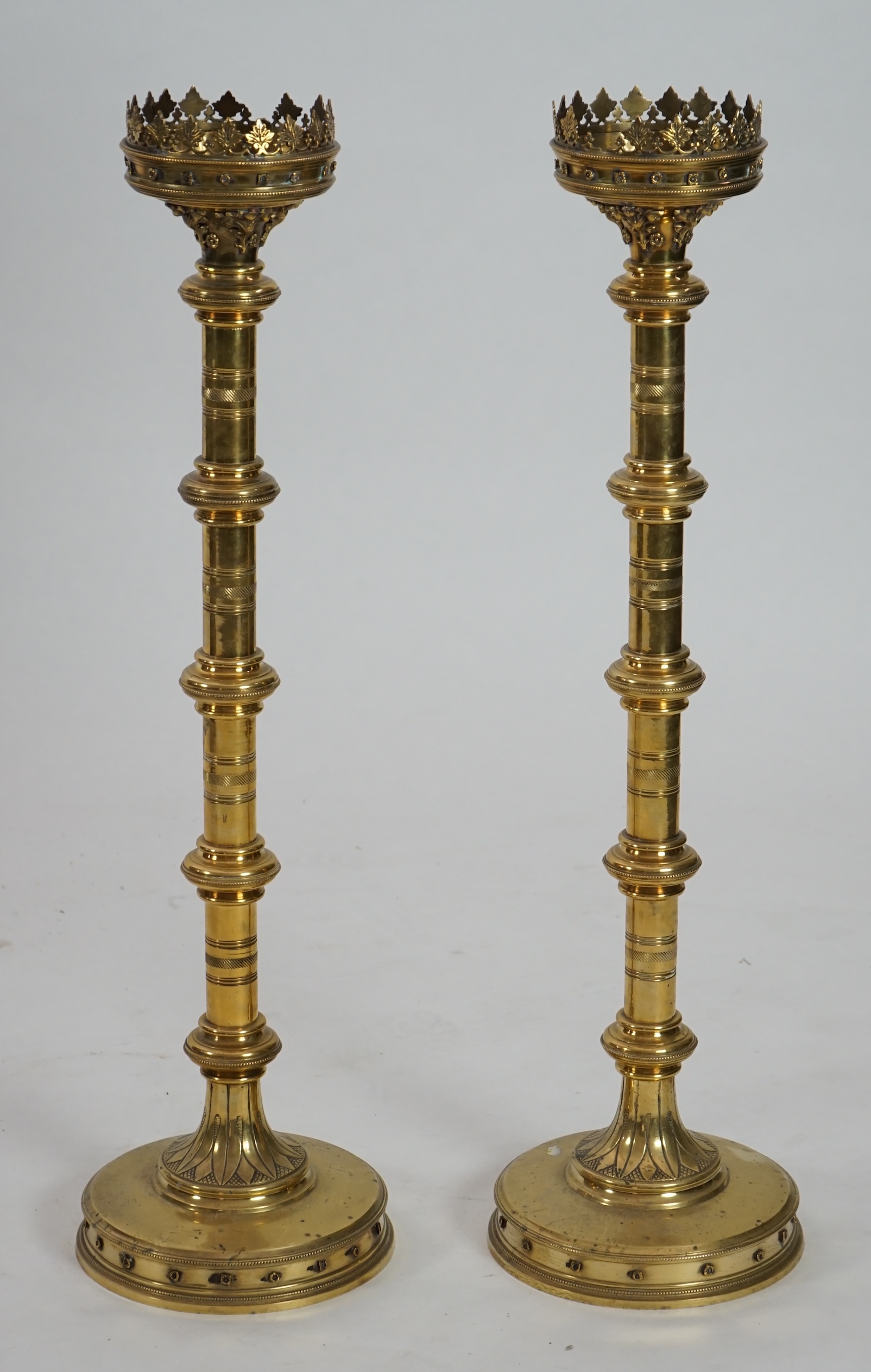 A pair of Victorian Gothic brass altar sticks